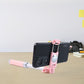 Selfie stick adjustable clamp holding a smartphone securely