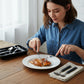 Dining cutlery set including spoons, forks, knives, and tea spoons with plastic handles