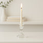 Crystal glass candle stand displaying stable base and clear glass
