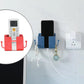 Wall mounted phone charging dock and remote control holder in a modern home.