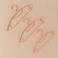Ganesh brand plastic cloth hangers showcasing smooth edges and sturdy build