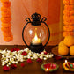 Matte black framed LED storm lantern with warm white candle light