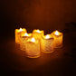Close up of LED tealight candle emitting warm flickering light and glitter