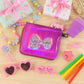 Zip-around kids wallet featuring a playful glitter-filled bow window design