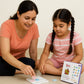 Family enjoying strategy Tic Tac Toe board game
