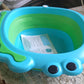 A side view of the practical foldable baby wash basin, highlighting its frog design.