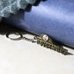 Jai Dwarkadhish metal keychain with detailed spiritual design