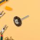 A shank-mounted brass wire brush, ideal as a drill attachment for metal grinding.