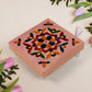 Square-shaped wooden bajot with detailed Meenakari artwork for puja rituals.