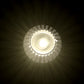 Close-up of a crystal-patterned LED flameless candle glowing warmly
