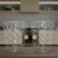 Side view of pyramid plastic glass showcasing wide stable base