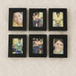 Close-up of matte black frames in the 12-piece photo frame set