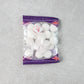 Close-up image of round naphthalene mothball tablets for wardrobe freshness