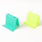 Top view of multifunctional mobile phone stand and pen holder in assorted colors