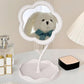 Hand adjusting the angle of the rotatable flower makeup mirror