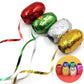 Close-up of a hand curling a balloon ribbon, showing its decorative effect.