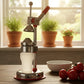 Manual citrus juicer side view showing compact design