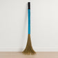 Close-up view of floor broom head with synthetic bristles