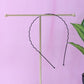 Individual metal wave hair band showing rounded protective tips
