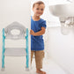 Close-up of the soft padded seat and splash guard of the potty training seat.