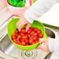 A Quickslice rice washing bowl with a thick drain basket and handle, perfect for kitchen use.