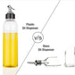Clear 1 litre oil dispenser on a kitchen counter, ready for use.