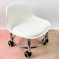 Close-up of the smooth 360-degree swivel wheels on the low roller seat for easy mobility.