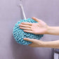 Hanging hand towel draped casually over a bathroom sink.