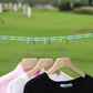 Clothesline rope securely holding clothes outdoors, perfect for camping.