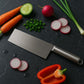 Close-up of stainless steel cleaver blade showcasing sharp edge