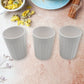 Side view of a single unbreakable plastic tea cup on a clean background.