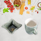 Four-piece ceramic tea and snack bowl set displayed for size reference on a table.