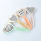 The complete set of heart grater and slicer tools displayed in a modern kitchen setting.