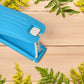 Side profile of the compact 2-in-1 vegetable cutter and peeler, showcasing its sleek design.