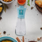 Fine mist spray from the oil dispenser bottle evenly coating food during cooking.