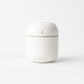 Mini USB Humidifier releasing a visible cool mist plume.