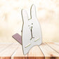 Another angle of the wooden rabbit mobile stand, highlighting its compact size.