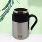 Person holding the Bottlart vacuum insulated mug with its ergonomic handle.
