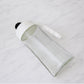 Automatic lid mechanism opening on glass oil bottle dispenser