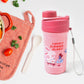 Overhead view of the complete lunch box set, including the reusable food container, bottle, and fork.