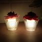Detailed view of rose flower top on LED flameless tealight candle