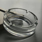 Durable crystal glass ashtray suitable for both indoor and outdoor use.