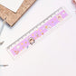 Children using cartoon-themed plastic ruler for drawing and geometry