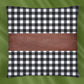 Stylish leather and cotton cushion covers adding a chic accent to a bedroom setting.