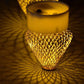 Bottom view of a flameless LED candle showing the battery compartment and on/off switch.