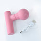 Top view of the black body massager, highlighting its simple button.