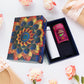 Golden designer gift box containing rose almonds and stainless steel bottle