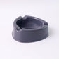 Unbreakable grey plastic ashtray with smooth surface for easy cleaning