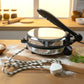 Detailed view of stainless steel heating plate in electric roti maker