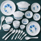 Full plastic dinner plate with elegant fluted edges and blue floral design